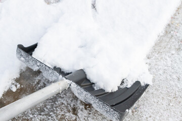 Snow cleaning with a large shovel in winter - 488168971