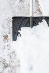 Snow cleaning with a large shovel in winter - 488168988
