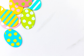 Colorful easter eggs. Happy easter greetings concept, holiday decoration background with copy space, flat lay, top view photo