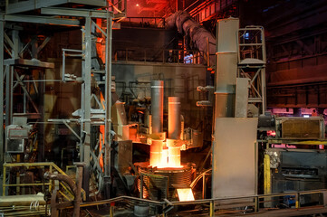 Electric arc steelmaking furnace, thick powerful red-hot graphite electrodes
