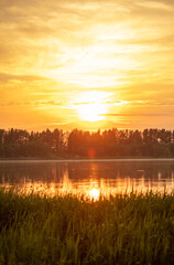 Obraz premium Lake at sunset in the summer.
