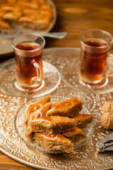 Baklava with nuts on a wooden background. Selective focus.