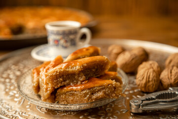 Baklava with nuts on a wooden background. Selective focus.