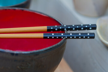 Asian style chopstick and bowl, Asian food concept, selective approach. 