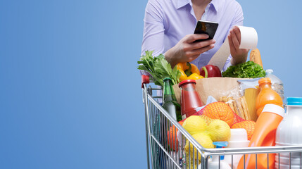 Woman checking the grocery receipt