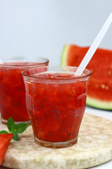 Es Semangka or Watermelon ice drink on isolated white background. Selective focus, copy space for text. 