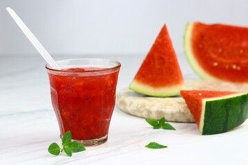 Es Semangka or Watermelon ice drink on isolated white background. Selective focus, copy space for text. 