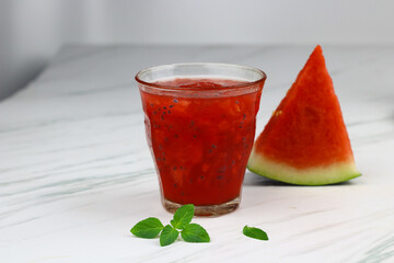 Es Semangka or Watermelon ice drink on isolated white background. Selective focus, copy space for text. 