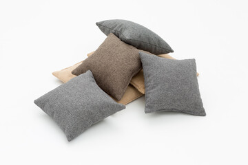 monochromatic sofa cushions on a white background