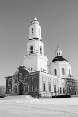 Christian church in a snowy field