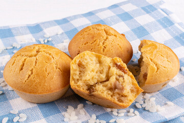 Delicious homemade rice cupcakes with raisins in a close-up section on a blue cloth napkin. Rice flour muffins. The concept of proper nutrition, a gluten-free diet.