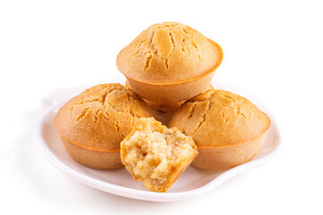 A plate with homemade rice cupcakes with raisins on a white isolated background. Rice flour muffins. The concept of proper nutrition, gluten-free diet, healthy lifestyle.