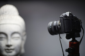 A closeup shot of Buddha statue in studio