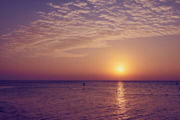The sun rises over the Red Sea at dawn.