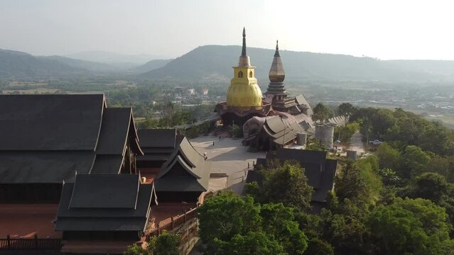 Wat Somdet Phu Ruea Ming Mueang Temple 4k fly over aerial view. Temple is built with fine wood timber. The church is made of teak and locate on mountain and best viewpoint at Phu ruea, Loei, Thailand