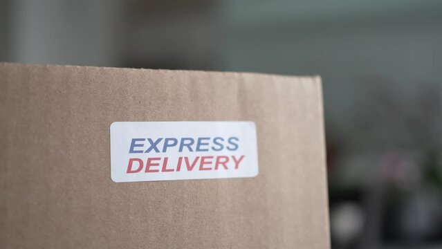 Express Delivery Sticker on a Shipping Box With Products