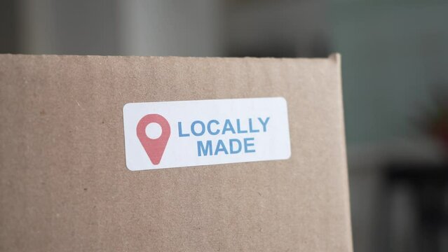 Locally Made Sticker on a Shipping Cardboard Box Closeup