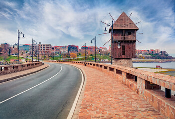 Fototapeta na wymiar Marvelous morning scene of Old Town of Nessebar with old wooden windmill. Wonderful spring scene of Bulgaria, Europe. Traveling concept background.