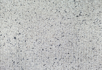 real terrazzo cement wall with shallow groove pattern. close up view of vintage grey concrete wall texture use as background. wall surface consists of marble and granite element.