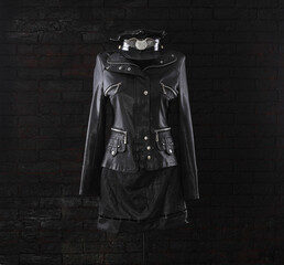 Naklejka premium black leather jacket and black leather skirt