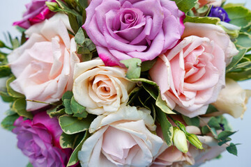 Bouquet of flowers - a composition of multi-colored roses.