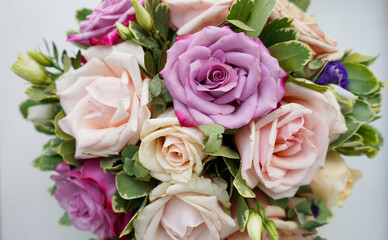 Bouquet of flowers - a composition of multi-colored roses.