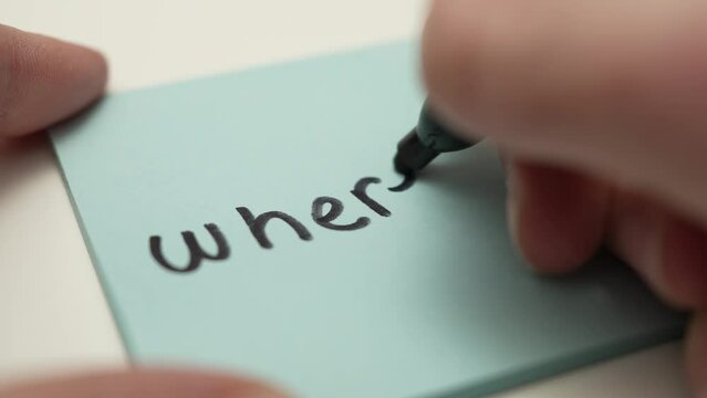 Where Question Hand Writing on a Paper Sticky Note Message Closeup