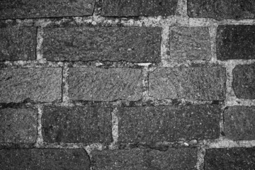 evocative  black and white image of rectangular shaped floor bricks
