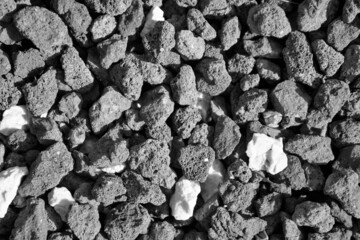 evocative texture black and white image of little pot stones
