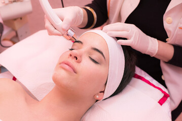 Obraz na płótnie Canvas Woman getting beauty treatment and skincare in modern beauty spa.