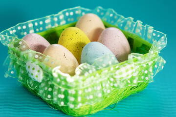 Easter sunday brunch, colorful eggs on a blue background with place for text