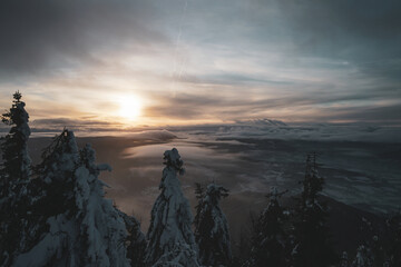 Dramatic Sunset with Frozen Trees and Valley View in Czech Republic from the top of mountain