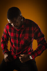 Portrait of black male fixing his shirt