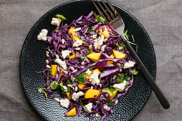 Home made red cabbage mango salad with vegan feta