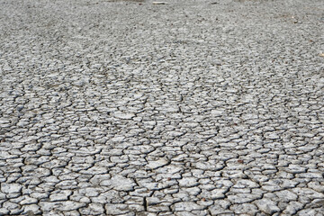 Cracked soil due to the long dry season. Rivers, lakes or ponds can dry and crack like this to form an irregular circle or hexagon pattern. Droughts like this often occur in African countries