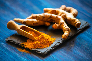turmeric powder and root. Food spice concept