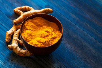 turmeric powder and root. Food spice concept