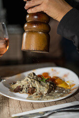 grilled tenderloin with mushroom sauce with cherry tomatoes and pepper