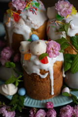 Fototapeta na wymiar Light Easter. Easter cakes and eggs with flowers. cherry blossom, spring blooming