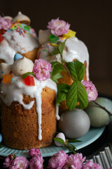 Dark Easter. Easter cakes and eggs with flowers. sakura, spring blooming