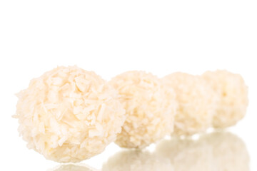 Some sweet candy with coconut shavings, macro, isolated on a white background.