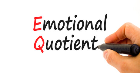 EQ emotional quotient symbol. Concept words EQ emotional quotient on white paper. Businessman hand with marker. Beautiful white background. Business EQ emotional quotient concept, copy space.