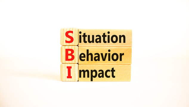 SBI situation behavior impact symbol. Concept words SBI situation behavior impact on blocks on beautiful white table white background. Psychological SBI situation behavior impact concept. Copy space.