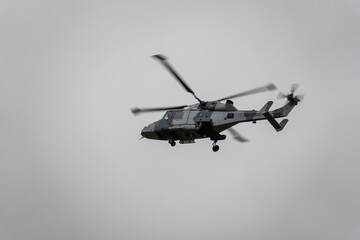 British army AgustaWestland AW159 Wildcat AH1 helicopter flying on military training exercises, Wiltshire UK