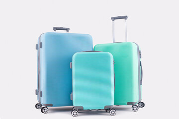 Blue Mint Green suitcase isolated on pastel background vacation luggage