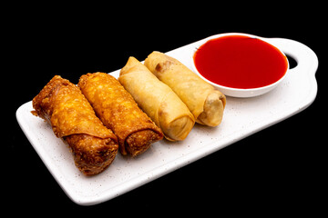Spring rolls and egg rolls with a dipping sauce