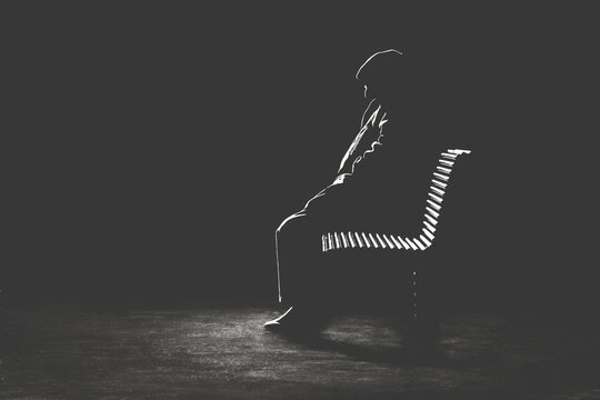 Illustration of light profile of lonely old man waiting on a bench in the park, minimal solitude concept
