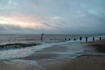 Fototapeta na wymiar Sunrise over the sea at Gorleston-on-sea in Norfolk, UK. January 2022