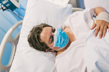 Chubby female patient sleeping in hospital during coronavirus