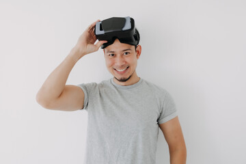 Happy Asian man present virtual glasses application for metaverse technology.